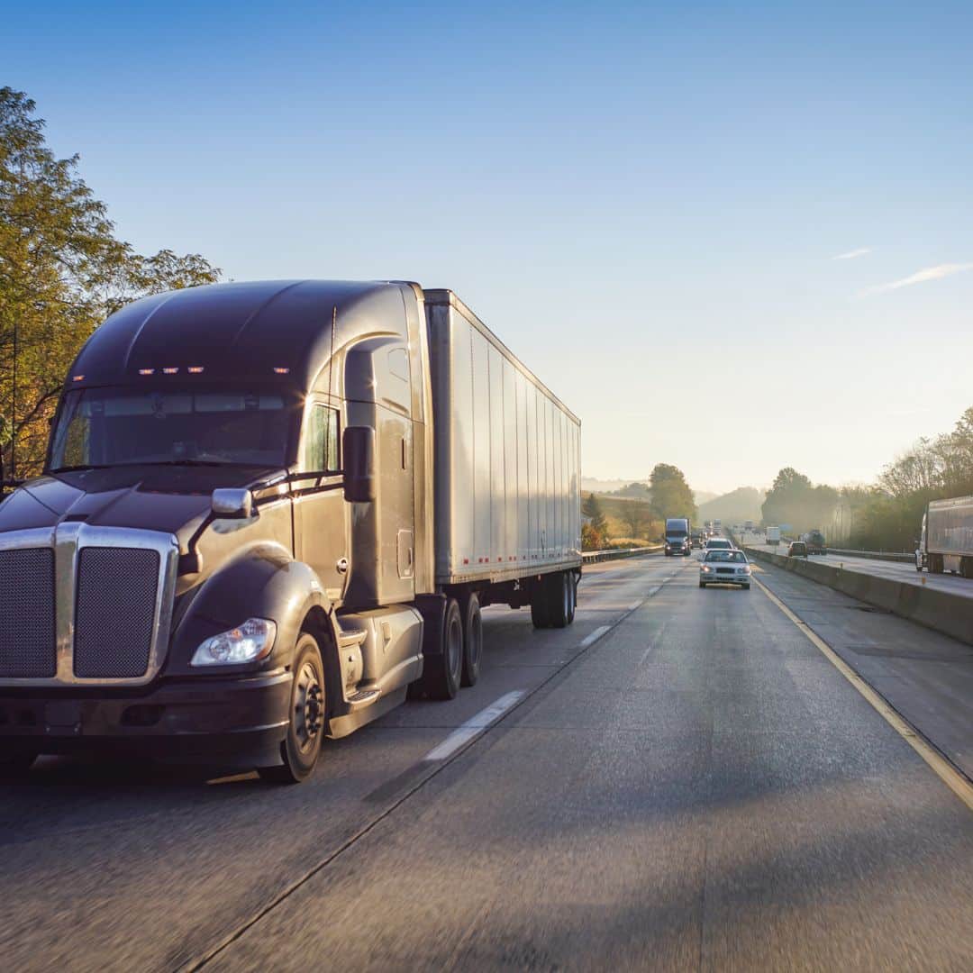 A sem-truck going down the highway. 