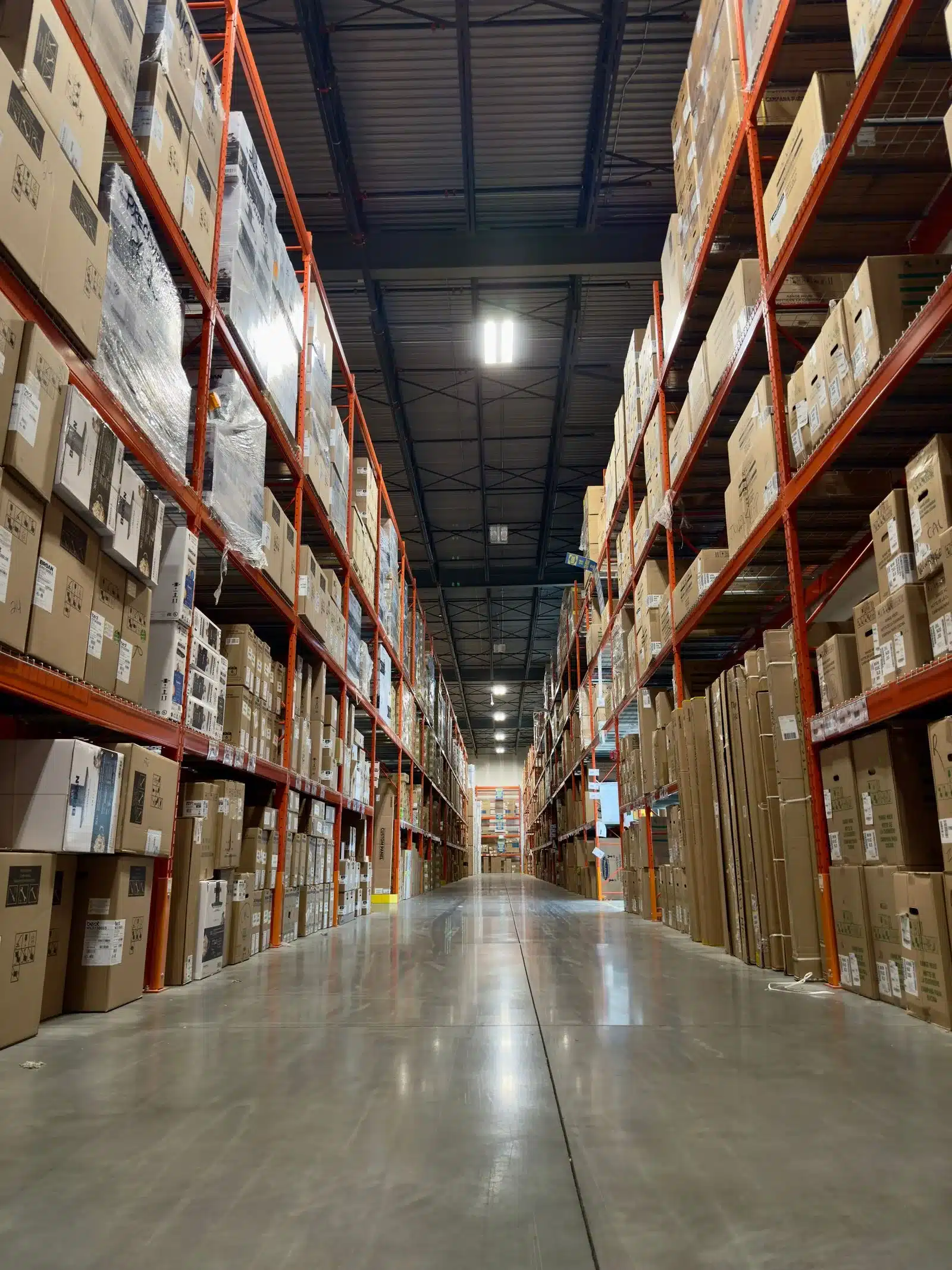 Stacked inventory on tall warehouse shelving representing Florida distribution capacity